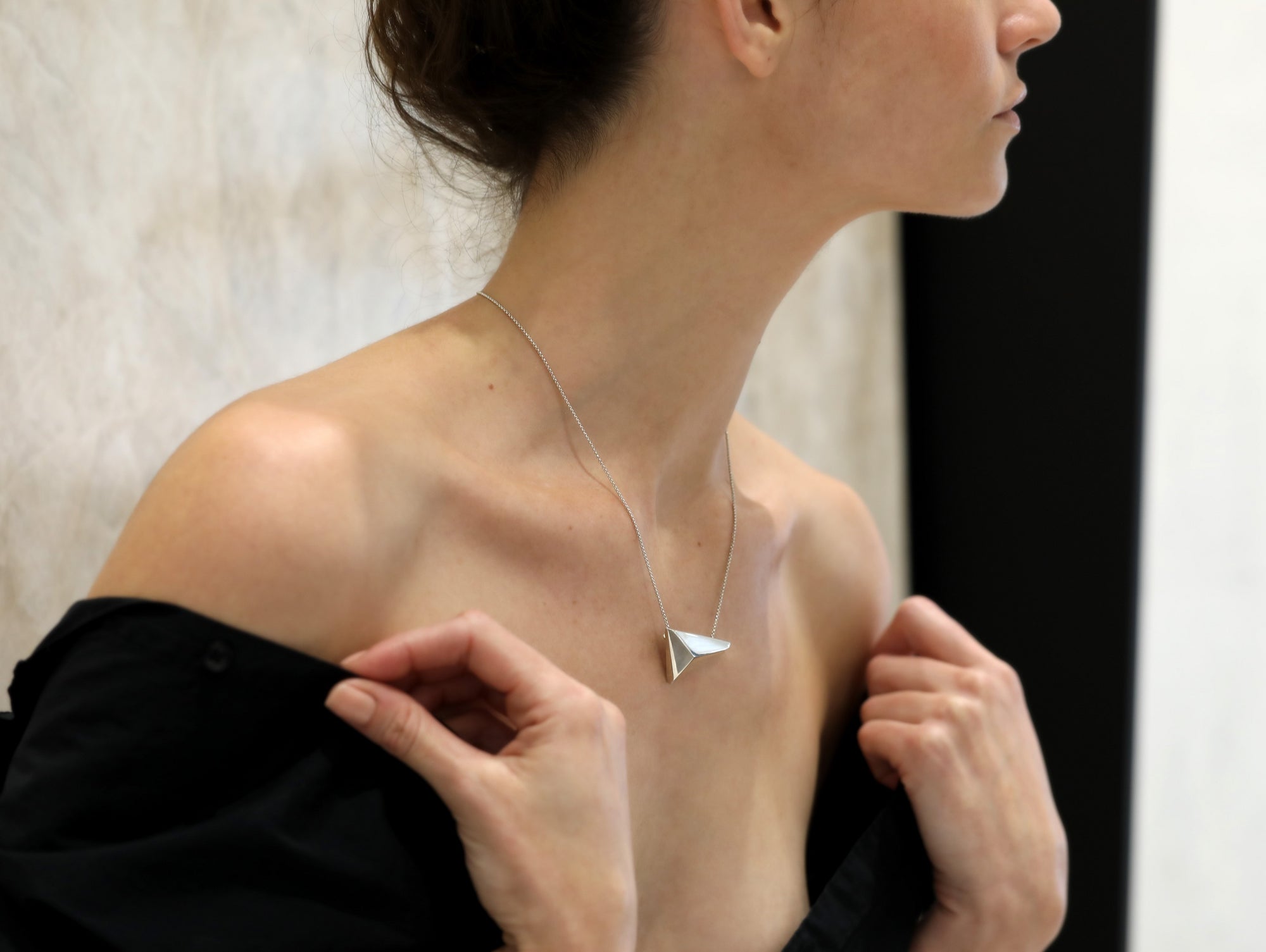 Girl wearing statement sterling silver pendant