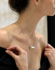 Girl wearing statement sterling silver pendant