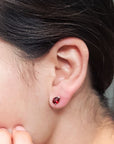 Girl wearing pear cut pyrope garnet stud earrings bena jewelry montreal pear shape red garnet gemstone montreal little italy jeweler red gemstone earrings