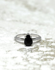 Front view of black pear shape gemstone gold engagement ring natural black spinel gemstone fine jewelry montreal little italy bena jewelry jeweler custom made color gemstone engagement ring montreal made in canada fine jewelry designer