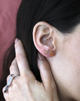 girl wearing bena jewelry gold stud earrings orange sapphire montreal