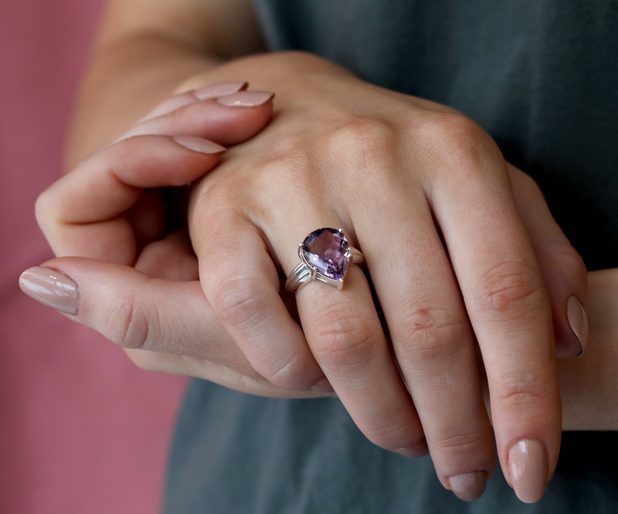 Girl wearing bena jewelry ametrine cocktail ring purple orange quartz natural gemstone from brazil custom made fine jewelry montreal fine jewelry designer montreal made in canada bolc cocktail custom silver ring color gemstone specialist montreal canada