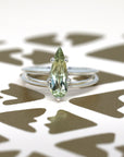 front view of pear shape green gemstone engagement custom made ring bridal jewelry designer montreal handmade in little italy ethical local jewelry studio large green pear shape diaspore gemstone bridal edgy ring