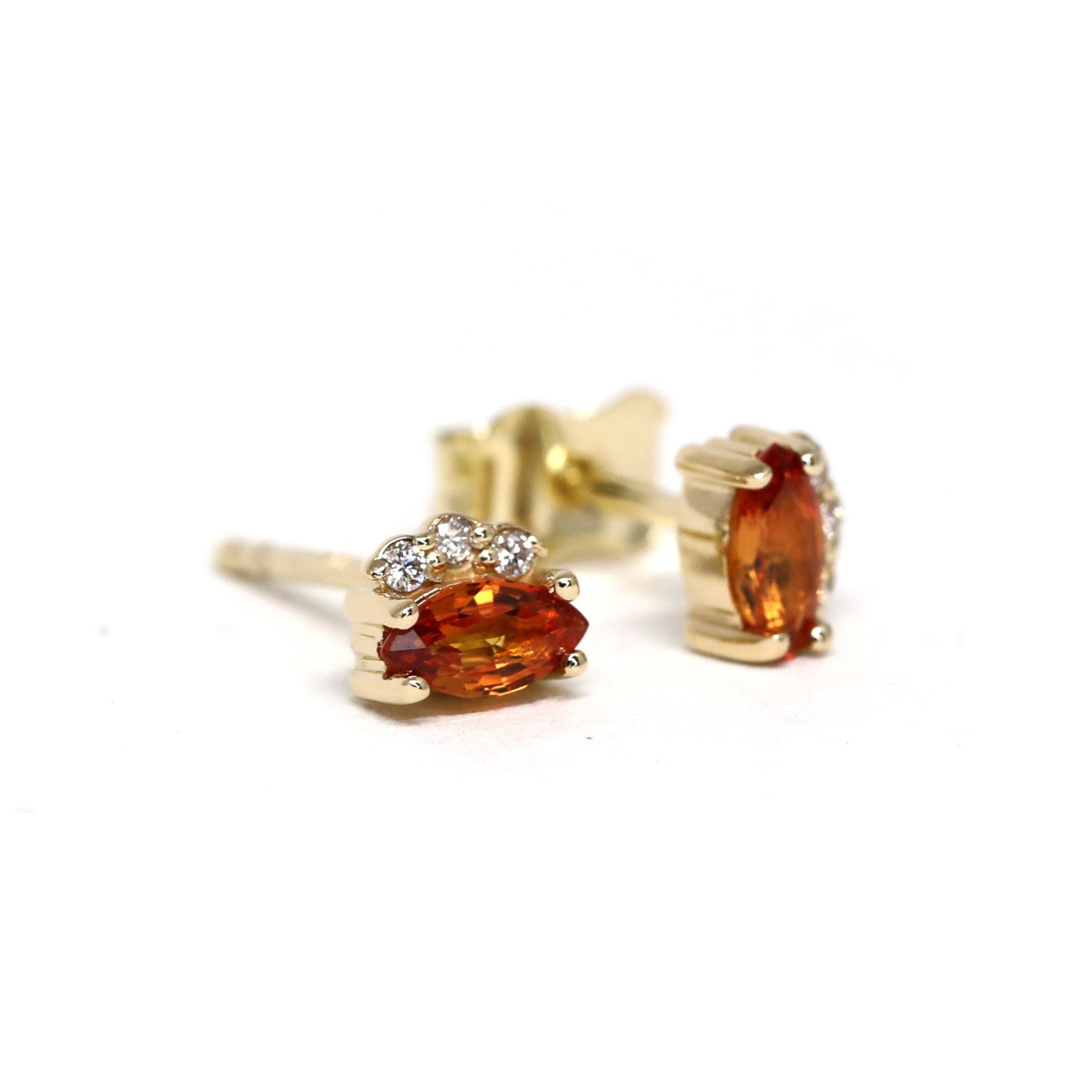 side view of sapphire diamond gold studs earrings bena jewelry designer montreal handmade fine jewelry ruby mardi jewelry gallery canada fine jewelry designer dainty simple gemstone studs earrings montreal