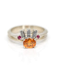 front view of salt and pepper diamond baguette wedding abnd and matching spessartite garnet engagement ring made in montreal by bena jewelry designer on a white background