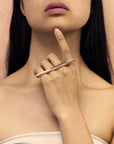 Grand Punch ring in white gold worn by a woman. Contemporary unisex jewelry by Bena Jewelry, handmade in Montreal and available at Ruby Mardi.