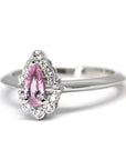 Side view of pink sapphire engagement ring bena jewelry montreal pear shape natural pink gemstone edgy bridal custom made jewelry bridal engagement ring diamond halo made in montreal handmade in canada bena jewelry fine jewelry Montreal Little italy jeweler