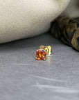 Orange sapphire gemstone trillion cut stud earrings 18 kt yellow gold