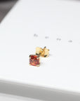 Orange sapphire gemstone trillion cut stud earrings 18 kt yellow gold