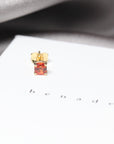 Orange sapphire gemstone trillion cut stud earrings 18 kt yellow gold