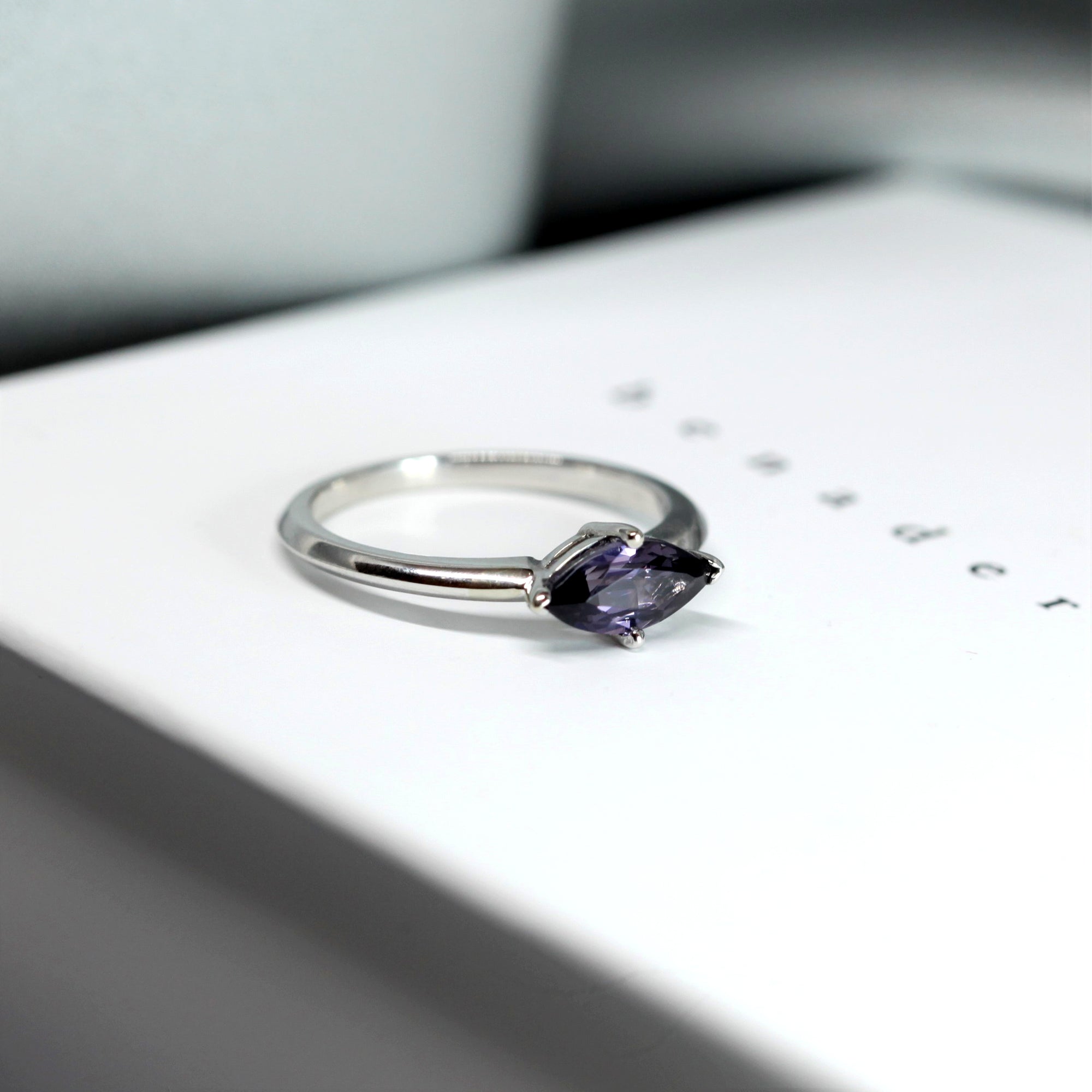 Side view of edgy color gemstone ring bena jewlry marquise shape spinel white gold ring montreal made in canada fine jewelry designer custom made engagement ring specialist