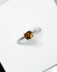 top view of bena jewelry oval shape orange gemstone engagement ring montreal fine bridal jewelry bena jewelry montreal little italy jeweler color gemstone natural zicon orange color whit gold ring