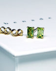 front view of peridot gemstone yellow gold stud earrings bena jewelry montreal made jewelry custom made color gems jewelry minimalist earrings bridal color gemstone jewelry natural vivid green gemstone jewelry