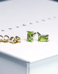 front view of bena jewelry peridot stud earrings custom made peridot jewelry montreal baguette shape gems earrings small green studs bena jewelry montreal handamde jewelry little italy jewelry studio