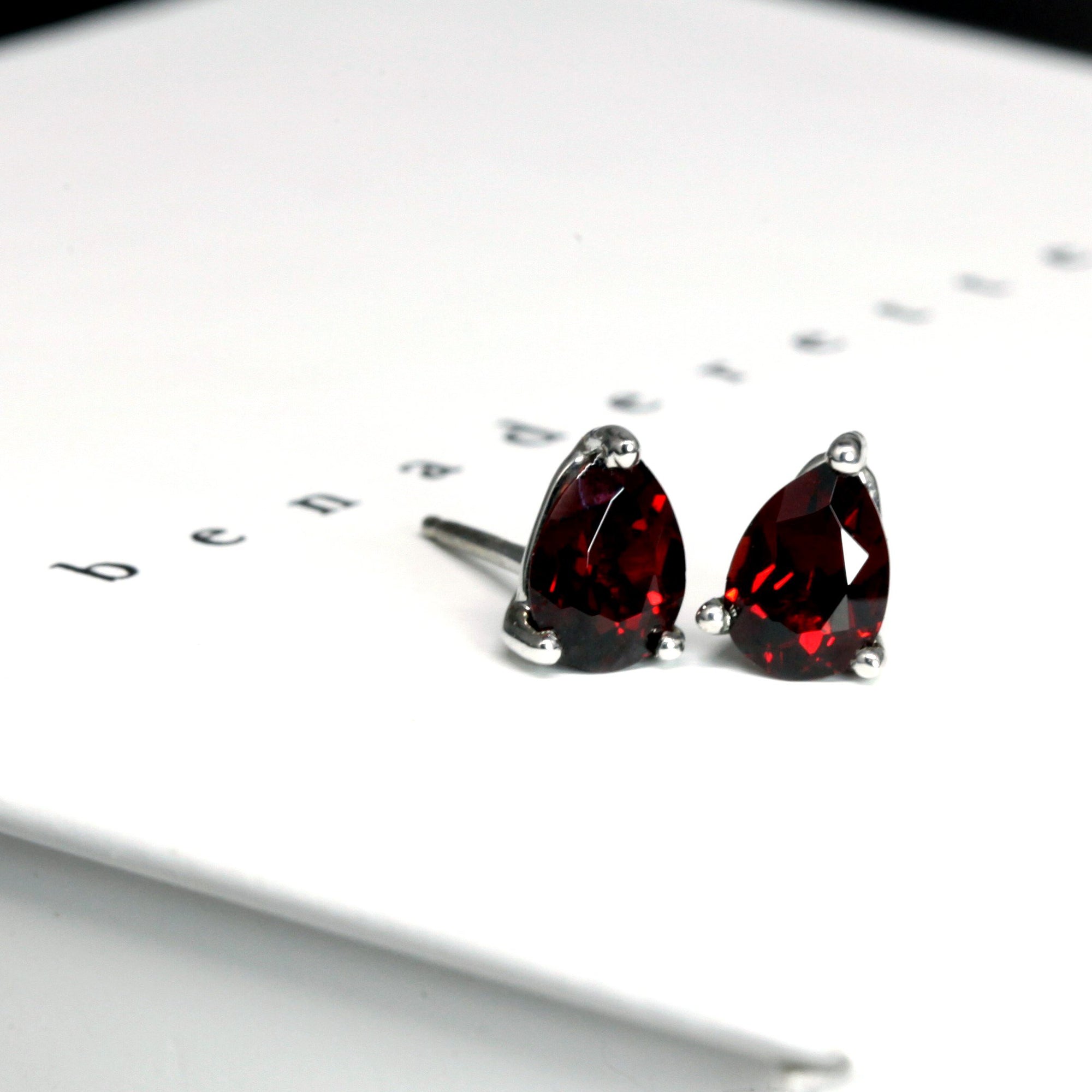 ref garnet gemstone stud earrings bena jewelry montreal pear shape red pyrope garnet custom earrings montreal made in canada unisex fine jewelry deep red natural gemstone earrings studs bena jewelry custom color gemstone fine jewelry