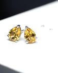 Front view of yellow gemstone stud earrings bena jewelry minimalist color gemstone jewelry citrine earrings pear shape natural gemstone quartz montreal made in canada fine jewelery designer color gemstone bridal jewelry
