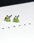 Peridot gemstone stud earrings montreal bena jewelry custom made color gemstone fine jewelry minimalist gemstone earrings studs green gemstone trillion shape earrings studs bena jewelry montreal