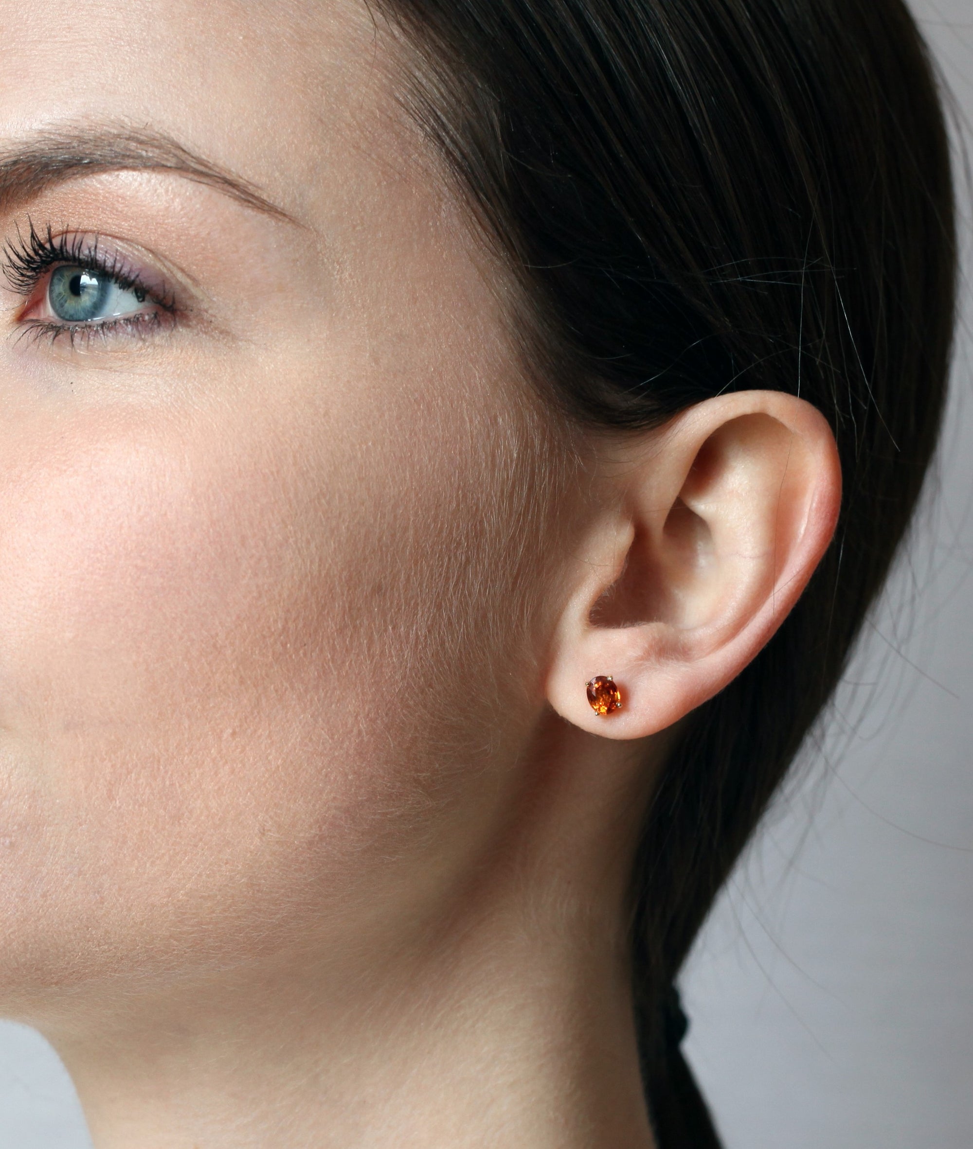 girl wearing bena jewelry garnet jewelry color gemstone stud earrings natural orange color gemstone bridal color gemstone jewelry