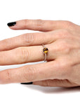 girl wearing color gemstone engagement ring natural zircon fire orange gemstone gold ring handmade in montreal little italy minimalist gold engagement ring with fancy color gemstone oval shape natural gems bena jewelry montreal custom made jewelry white gold ring orange natural gemstone