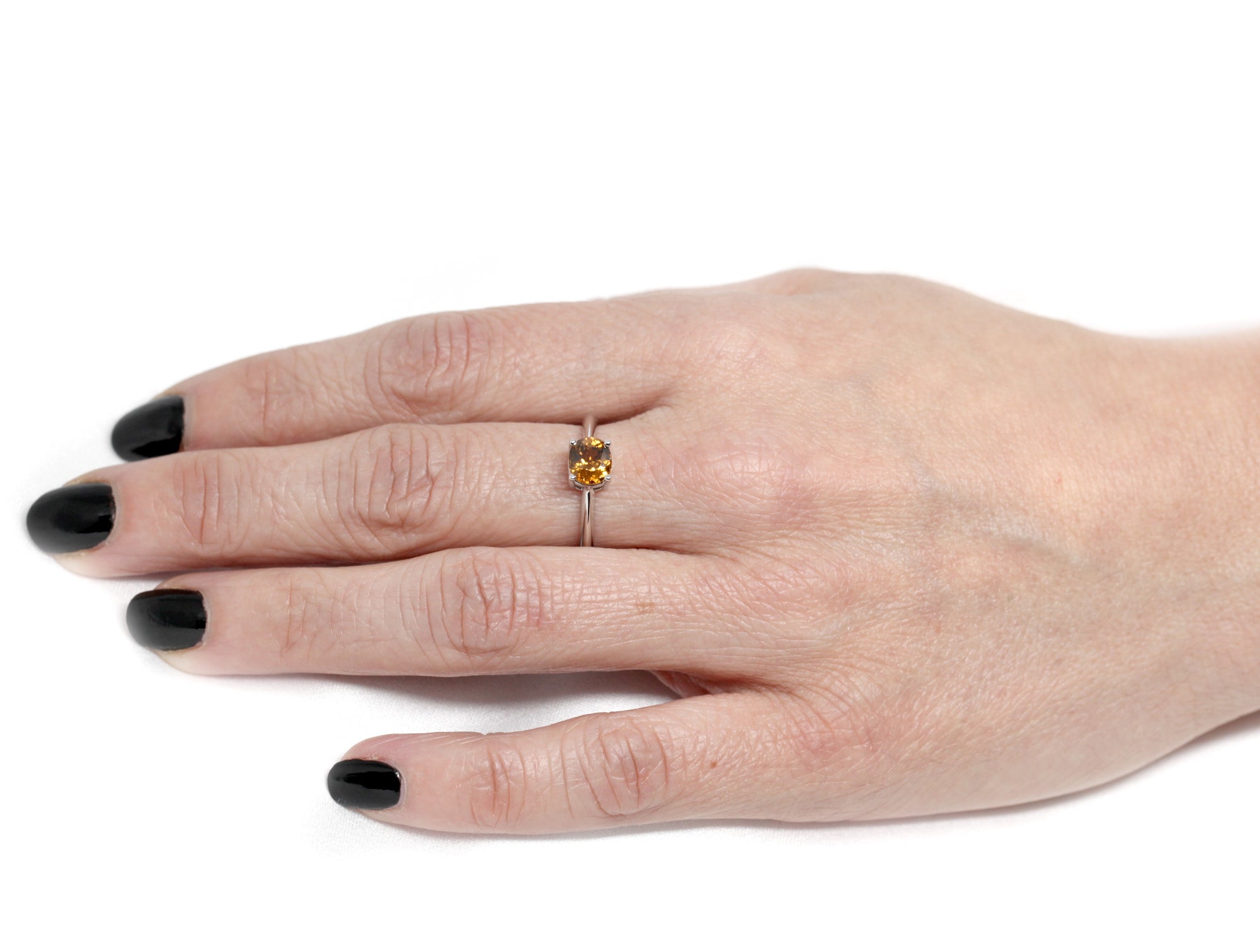 girl wearing orange color zircon natural gemstone engagement ring montreal handmade in canada little italy montreal jeweler custom made color gemstone engagement ring local ethical jewelry studio bena jewelry montreal