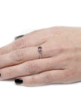girl wearing a pear shape garnet engagement natural pink malaya drop shape gemstone custom ring montreal handmade fine jewelry made in canada custom colored gemstone bridal ring bena jewelry