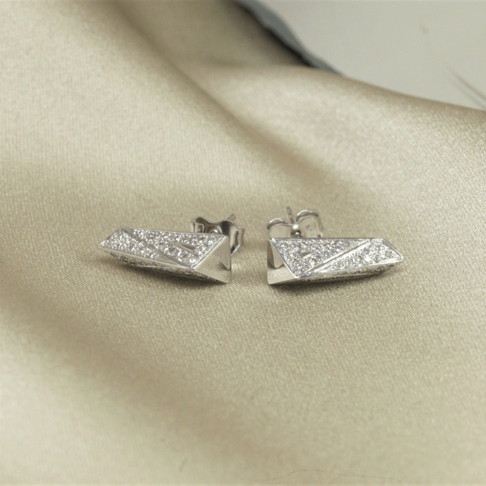 Side view of the white gold stud earrings Bena Jewelry Montreal Made in Canada one of the kind bold fine edgy jewelry