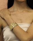 Girl wearing statement gold plated bracelet bena jewelry collection chiseled fine jewelry designer montreal made in canada