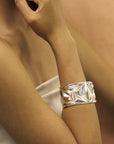 girl wearing a bena jewelry bold statement bracelet montreal handmade fine jewelry silver bracelet montreal habdmade cocktail fine jewelry little italy montreal jeweler custom jewelry designer