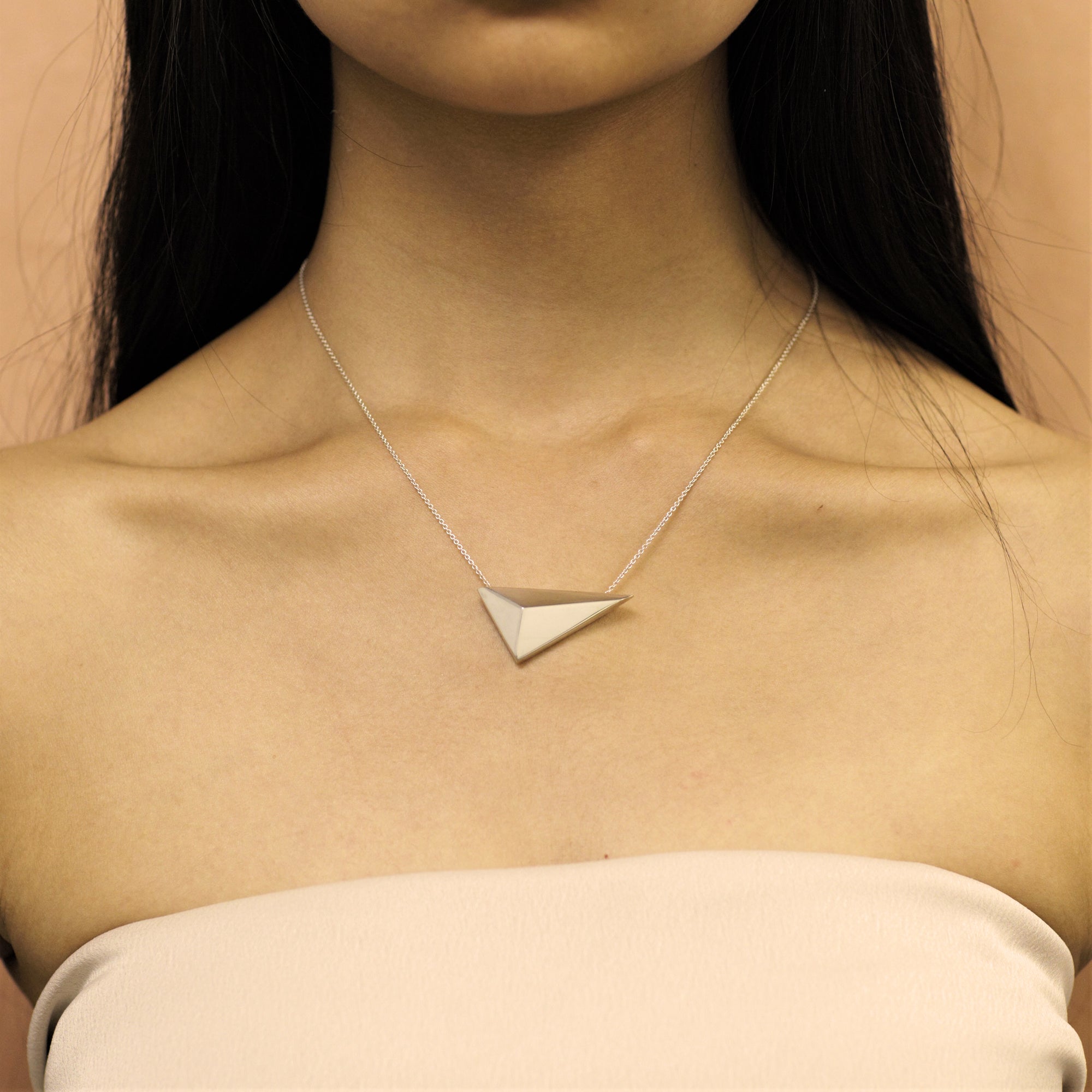 Girl wearing statement sterling silver pendant