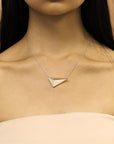 Girl wearing statement sterling silver pendant