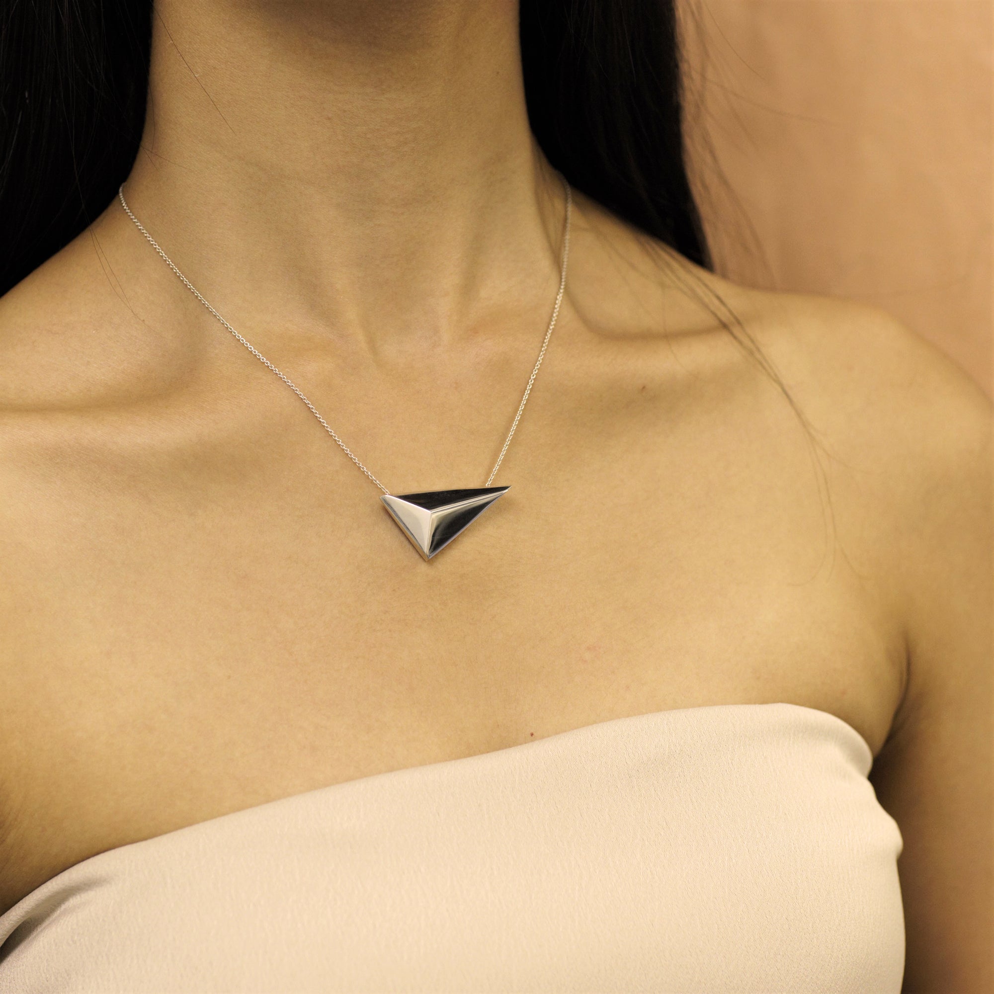 Girl wearing statement sterling silver pendant