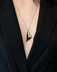 Girl wearing edgy pyramidal pendant bena jewelry montreal made in canada cool fashion montreal jewelry designer canadian artisit gold pendant unisexe minimalist bold look luxury fine custom made jewelry montreal little italy jeweler