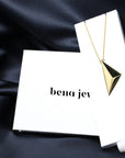 Front view of edgy pyramidal pendant montreal made in canada vermeil gold silver plated jewelry design in the jewelry box packaging custom made in montreal canada fine jewelry design luxury experience