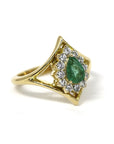Front view of the Adorn Pear Shape Emerald & Halo Ring by Bena Jewelry, showcasing the pear-shaped emerald and its yellow gold halo. Made in Montreal, Canada, this custom piece highlights fine craftsmanship.