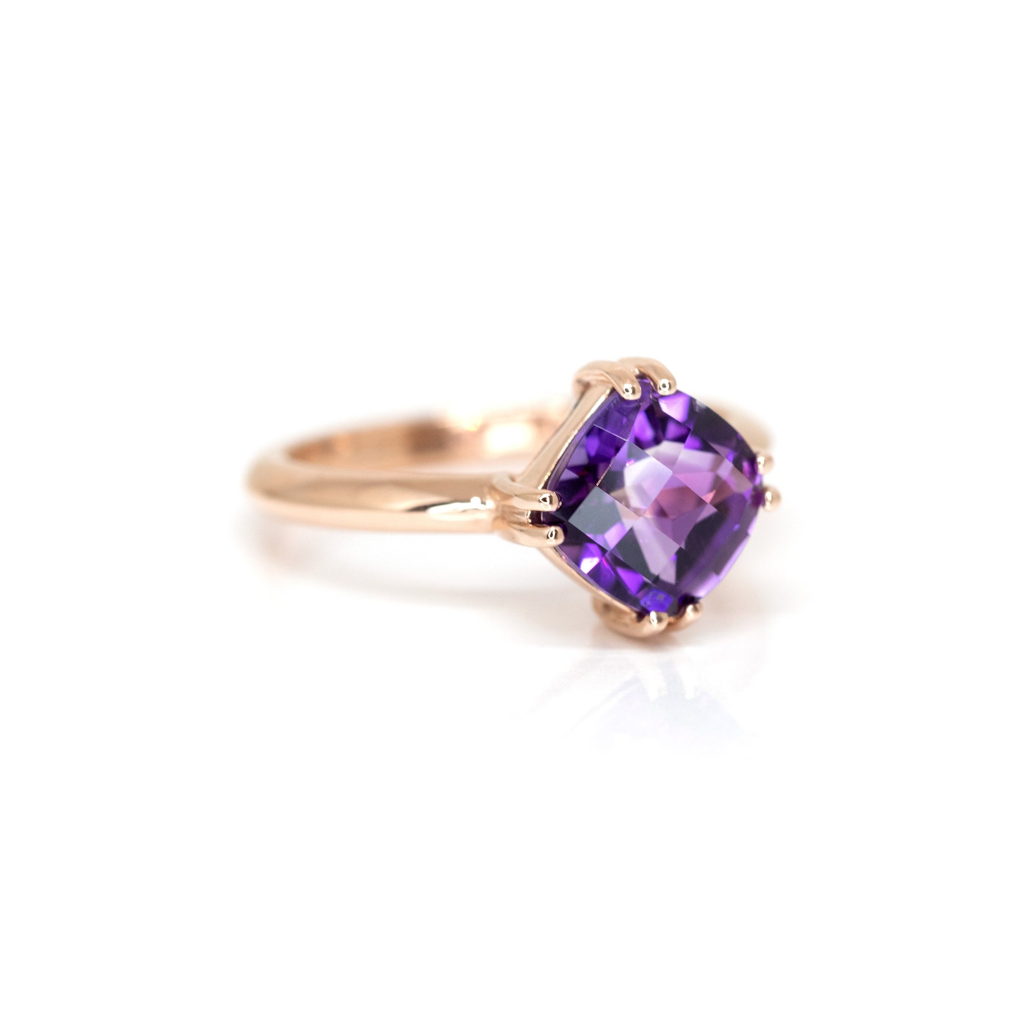 Elegant amethyst ring in rose gold, crafted with a deep purple cushion-cut gemstone. A one-of-a-kind designer piece made in Montreal.