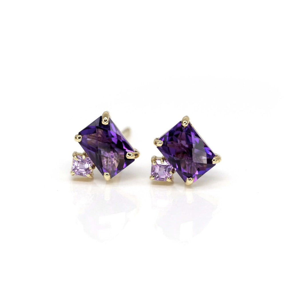 Front view on white background: A clear view of the Amethyst & Pink Studs Earrings, showcasing the checkerboard-cut amethyst and square pink sapphire set in yellow gold. Designed by Bena Jewelry in Montreal, Canada.