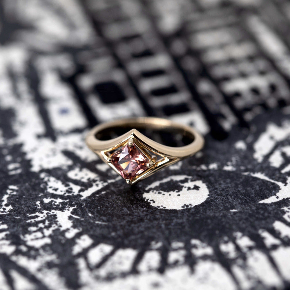 Front view: Displays the seamless construction of the yellow gold band and the secure setting for the Asscher-cut zircon. Made by Bena Jewelry in Montreal, Canada.