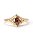 Front view: The Asscher Peach Zircon Ring in yellow gold, showcasing the Asscher-cut peach zircon’s precise geometric facets and its warm hues. Designed by Bena Jewelry in Montreal, Canada.