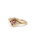 Top-down view: A clear perspective of the peach zircon’s Asscher cut, surrounded by the polished yellow gold band. Custom-made by Bena Jewelry, Montreal, Canada.