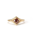 Front view of close-up: Focuses on the gemstone’s vibrant peach tones and the smooth finish of the yellow gold band. Designed by Bena Jewelry, an independent jeweler in Montreal, Canada.