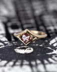 Top-down view: A clear perspective of the peach zircon’s Asscher cut, surrounded by the polished yellow gold band. Custom-made by Bena Jewelry, Montreal, Canada.