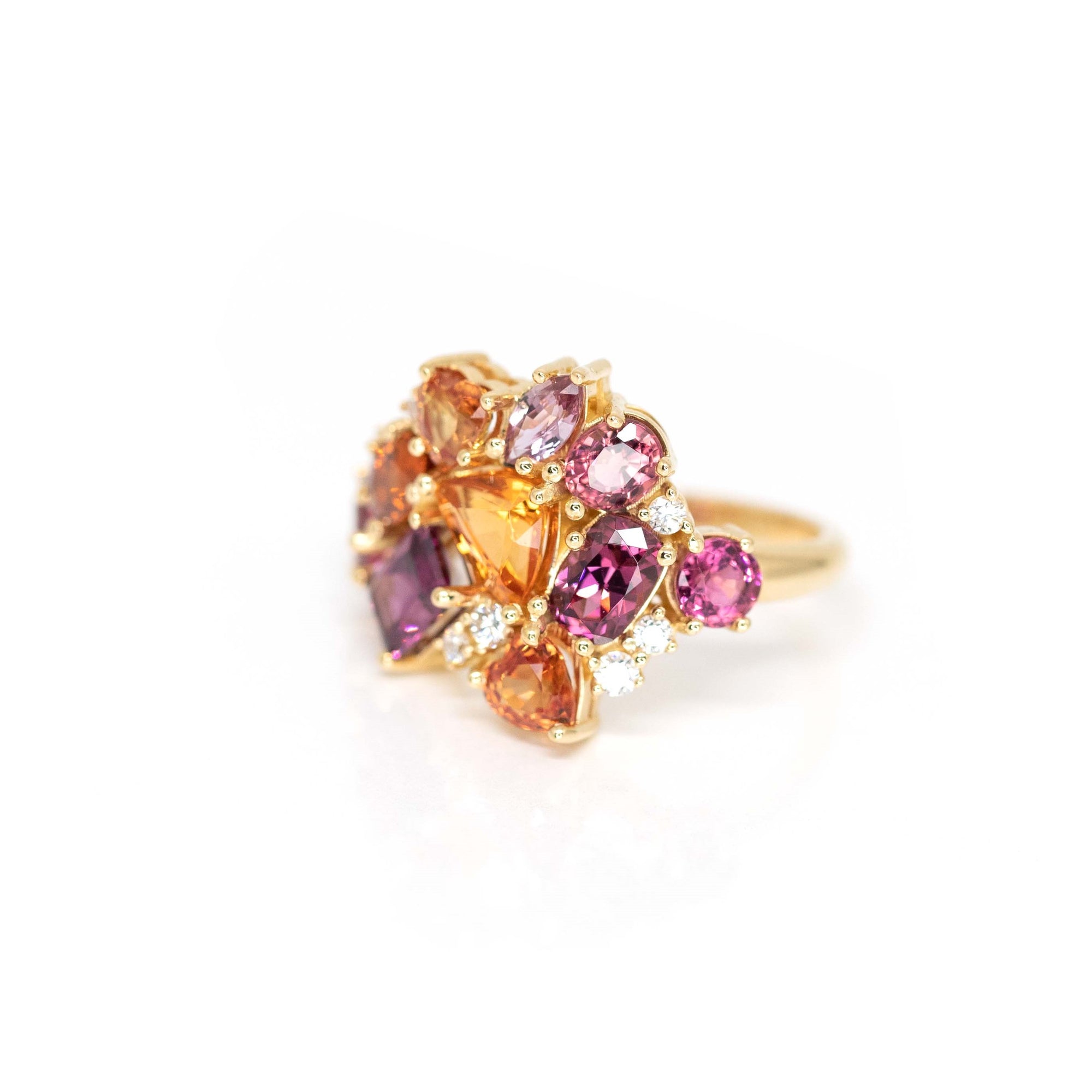 Side view: Highlights the depth and texture of the gemstone settings and the smooth finish of the yellow gold band. Custom-made by Bena Jewelry, Montreal, Canada.