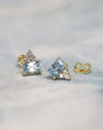 Designer-crafted earrings showcasing natural gemstones in a subtle yet striking yellow gold frame.