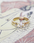 front view of set of gold ring with diamond custom made in montreal wedding bands on multi color background