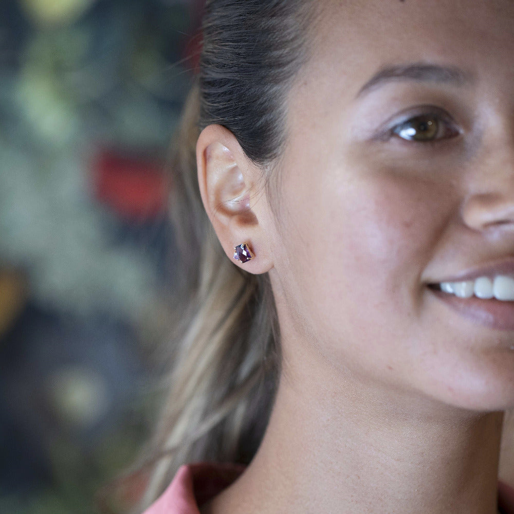Close-up of earrings worn (lifestyle): Focuses on the earrings in a natural setting, highlighting their bold yet refined aesthetic.