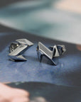 Side view of these unisex and bold small studs earrings made in white gold. Fine jewellery and modern design made in Montreal.
