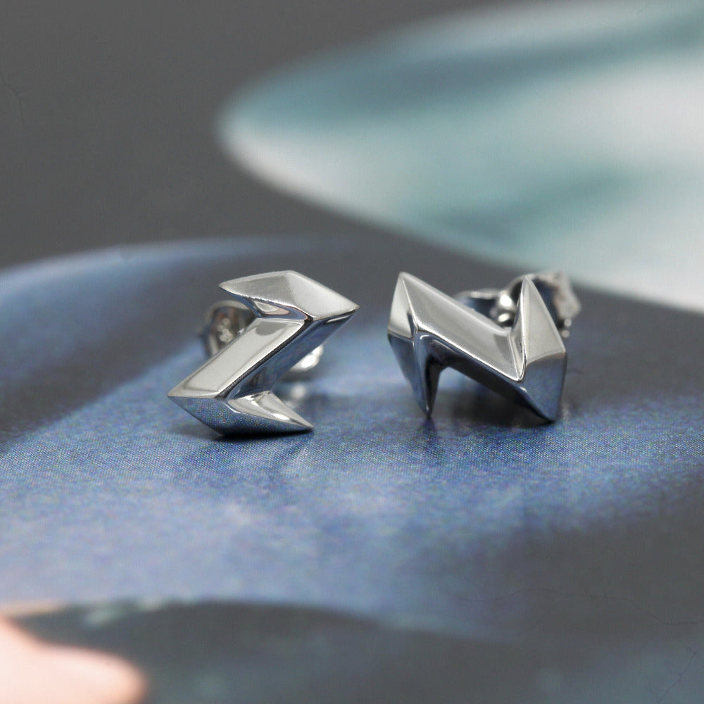 Front view of white gold Electric stud earrings made by the designer from Canada, Bena Jewelry.