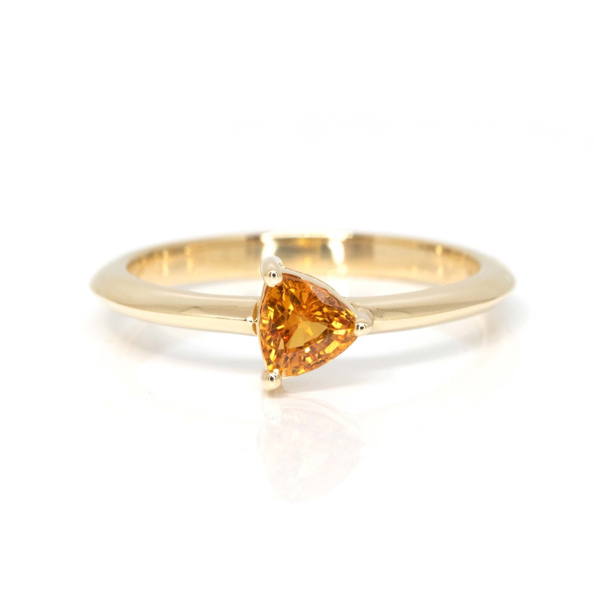 orange sapphire trillion shape yellow gold bridal ring made in montreal by bena jewelry designer on a white background