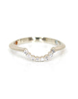 Custom-made white gold ring featuring a curved design with round diamonds in pavé setting, crafted by Bena Jewelry in Montreal, Canada. Minimalist and elegant on a white background.