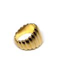 Close-up of Pigalle Ring in Yellow Gold – A statement dome ring with deep grooves and a high-polish finish.